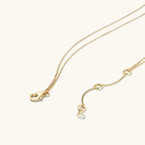 Golden double-layer necklace with lobster clasp and adjustable chain detail