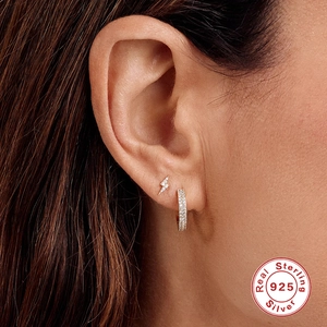 Elegant S925 sterling silver curved wave earrings with paved zircon on female model