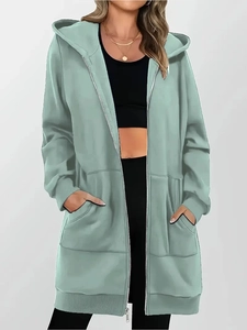 Detail view of bean green longline zip-up hoodie featuring large side pockets and ribbed cuffs