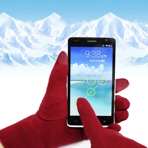 Close-up of red thermal fleece gloves with touchscreen fingertips for winter smartphone use
