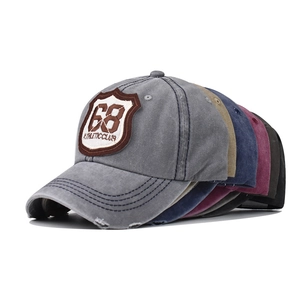 Detail of multi-color vintage washed baseball caps with 68 athletic club embroidery