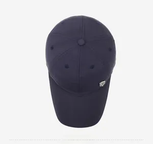 Top view of deep blue baseball cap showing six-panel structure and metal shield logo detail
