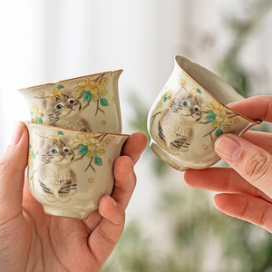 Ru-kiln ceramic teacup set with hand-painted tabby cat and floral patterns on wavy edges