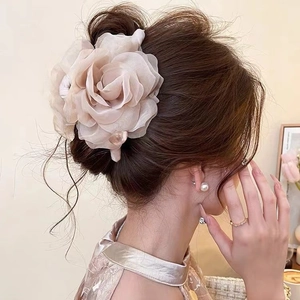Elegant mesh rose and pearl hair claw clip for women shown on back of head hairstyle