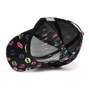 Macro view showing interior stitching and neon lip print on black baseball cap