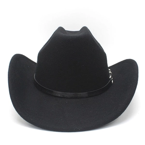 Detail of black western cowboy hat with wide brim and leather band with silver metal buckle