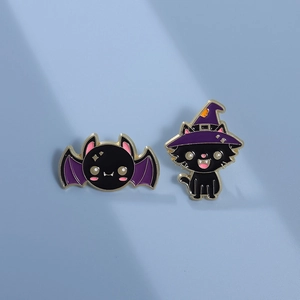 Cute Halloween enamel pins set featuring a cartoon black cat in a witch hat and a bat