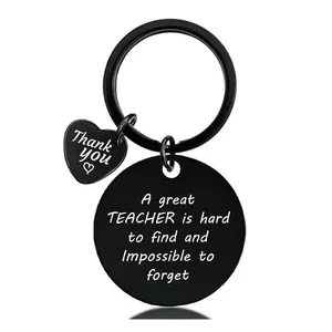 Close-up of black stainless steel keychain with engraved teacher appreciation message