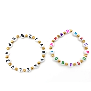 DIY alphabet bead bracelets featuring 7mm resin beads and gold spacers on white background