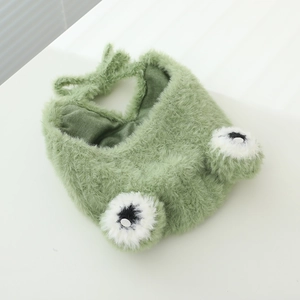 Detail of cute green frog plush hat with long fur texture and soft inner lining for babies