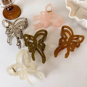 Set of five elegant jelly-colored hollow butterfly hair claws in assorted pastel shades
