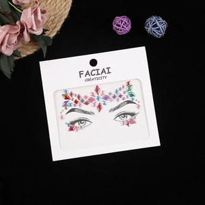 Close-up of colorful facial rhinestone stickers in geometric shapes on display card