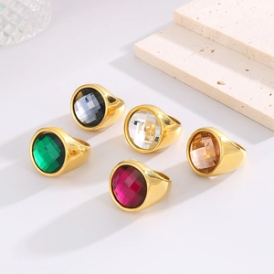 Detail of 22mm punk style stainless steel rings with colorful multifaceted crystals