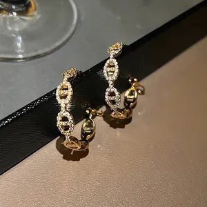Gold-plated hoop earrings with micro-paved cubic zirconia in a chic link design