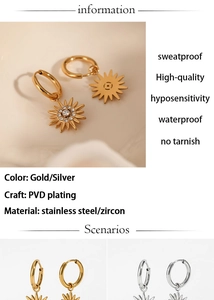 Macro view of stainless steel sun pendant earrings with PVD gold and silver plating