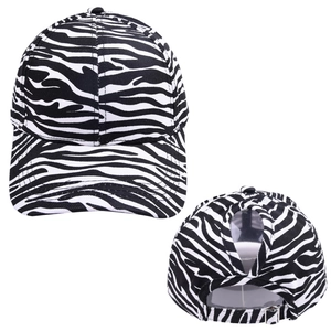Detail view of adjustable metal buckle and ponytail hole on zebra print baseball cap