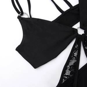 Macro detail of sexy black lace embroidery and metallic rings on slim fit bodysuit