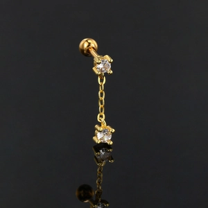 Golden chain cartilage piercing with dual round zircons and screw ball back on black background