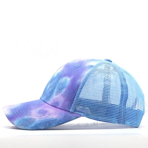 Macro detail of breathable blue mesh and tie-dye fabric on this stylish baseball cap