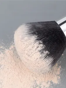 Macro shot of high-density synthetic fiber powder brush with polished metal ferrule