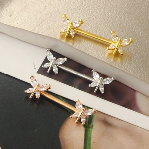 Three dragonfly nipple rings in gold, silver and rose gold with clear zircon crystals