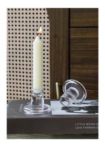 Set of two transparent crystal glass candle holders for taper candles on vintage books