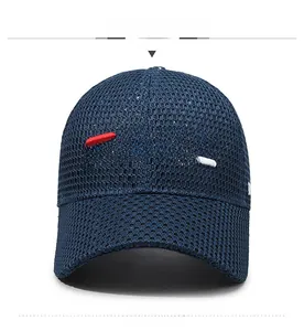 Close-up of deep blue mesh baseball cap featuring detailed 3D FBQE letter embroidery