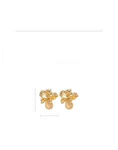 Macro detail of gold flower earrings showing 1.7cm size and resin pearl center