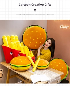 Detailed view of creative hamburger and french fries plush pillows on a cozy dining table