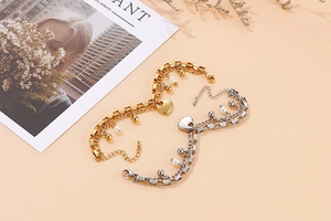 Détails du bracelet double couche en acier inoxydable avec pendentif cœur et perle