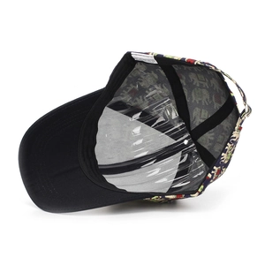 Detail of baseball cap mesh with elephant pattern and polyester care label inside