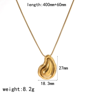 Detailed view of golden molten drop pendant with specific size and weight measurements