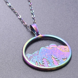 Detail of a rainbow-colored mountain pendant necklace in electroplated stainless steel