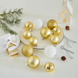 Golden and white Christmas tree ornament set with baubles and small gold house pendant