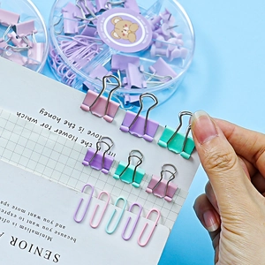 Pastel binder clips and paperclips set in a round case for office and student use