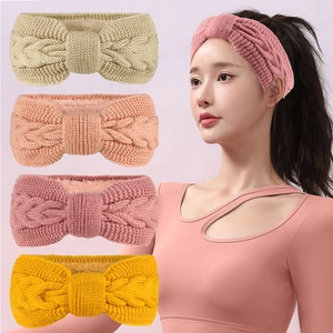 Detail of four colorful knit headbands with fleece lining and cable knit texture