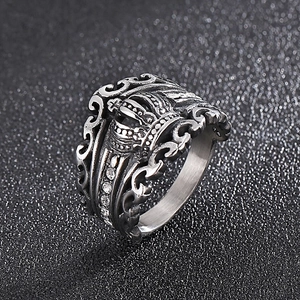 Detailed view of vintage silver crown ring with cubic zirconia and hollow out metal design