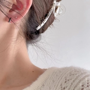 Minimalist 925 sterling silver hoop earrings with black zircon stones on female model