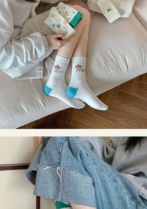 Detailed view of breathable cotton mid-calf socks with cute cartoon puppy embroidery