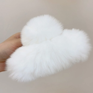 Detailed view of large white faux fur hair claw clip showing soft plush texture