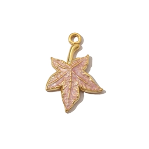 Detailed close-up of a pink enamel maple leaf pendant with a gold stainless steel rim