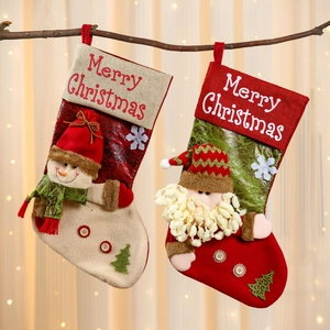 Linen Christmas stockings with 3D Santa and Snowman hanging on a festive branch