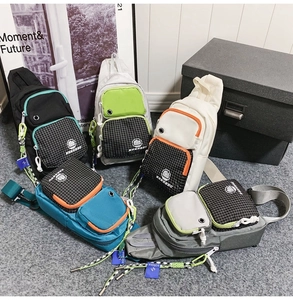 Detail view of multi-color water-resistant nylon crossbody bags with multi-pocket design