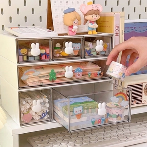 Three-layer desktop organizer with cream frame, transparent drawers, and white rabbit handles