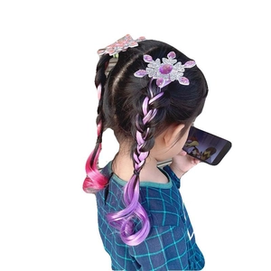 Detail showing frozen snowflake hair clip with pink purple gradient curly hair extension