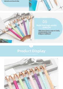Close-up of glitter ballpoint pens with large diamond toppers in multiple pastel colors