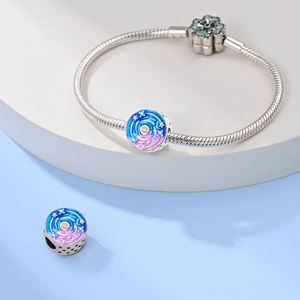 Detailed macro view of silver snake chain bracelet with star pattern enamel charm beads