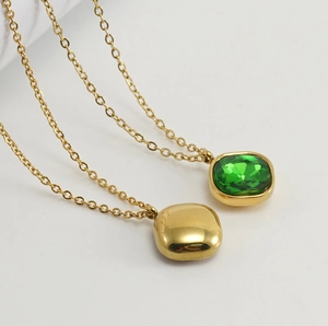 Detailed close-up of 18K gold stainless steel necklaces with green zircon square pendant