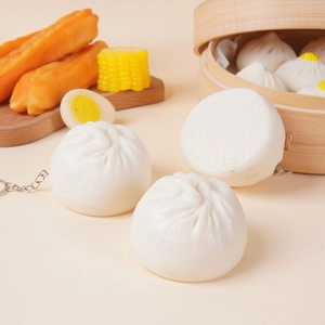 Realistic PVC steamed bun model food prop displayed in a wooden steamer for kitchen decor