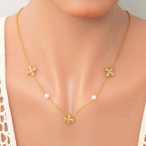 Elegant gold clover necklace set for women with white pearls and sparkling petals